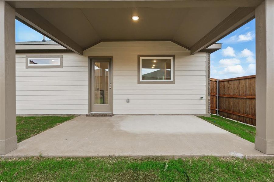 Exterior details and patio area of a home in Walden Pond, Forney (Image 17).