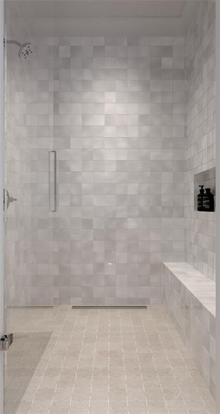 Full bathroom featuring a shower stall and tile patterned floors