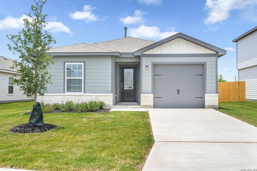 Front exterior of a new home in Luckey Ranch, San Antonio, TX, highlighting curb appeal (Image 1). Front exterior of a new home in Luckey Ranch, San Antonio, TX, highlighting curb appeal (Image 1).