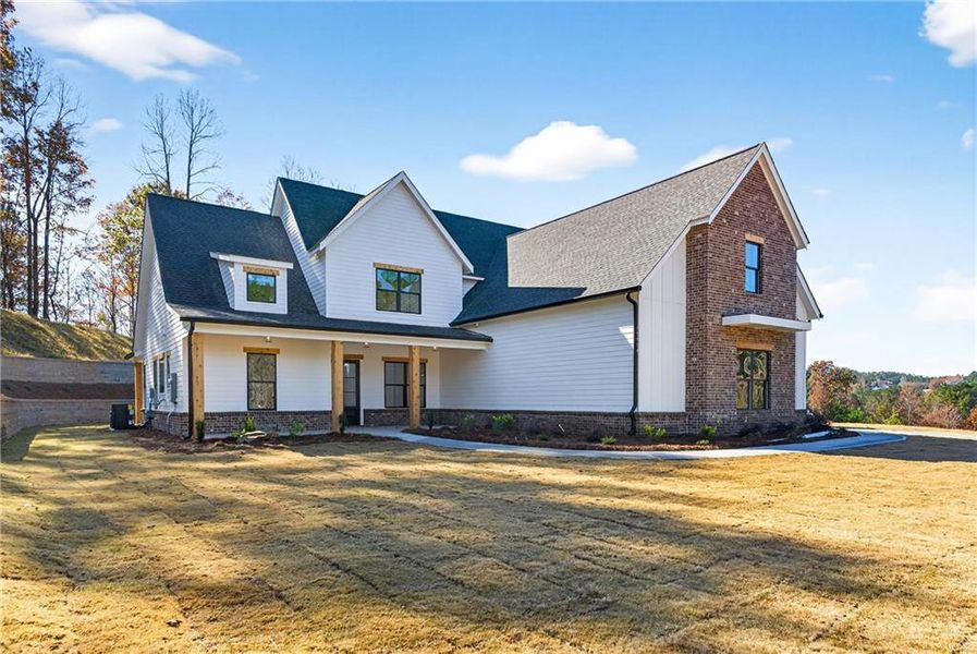 Front exterior of a new home in , Canton, GA, highlighting curb appeal (Image 2). Front exterior of a new home in , Canton, GA, highlighting curb appeal (Image 2).