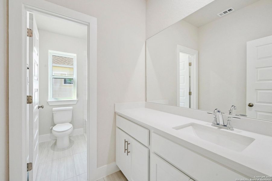 Furnished interior view inside a new home in Crown Ridge Manor, San Antonio (Image 6).