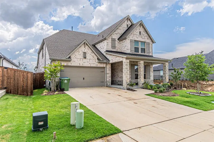 Front exterior of a new home in , Aubrey, TX, highlighting curb appeal (Image 24).