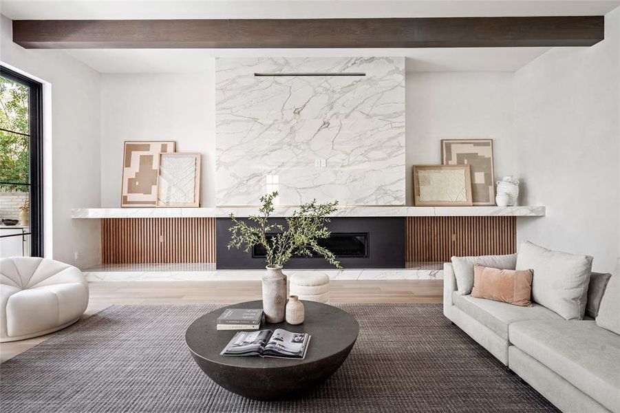 The breathtaking porcelain fireplace instantly becomes the focal point of this family room - creating a cozy and inviting atmosphere within this modern masterpiece. Adding an extra touch of opulence to this incredible home are the stunning, sleek Venetian plaster walls by Segreto, which run seamlessly throughout the first floor.