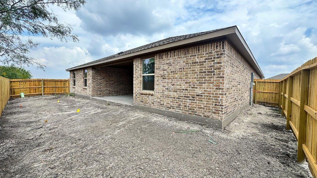 Exterior details and patio area of a home in The Lakes Northwest, Robstown (Image 24).