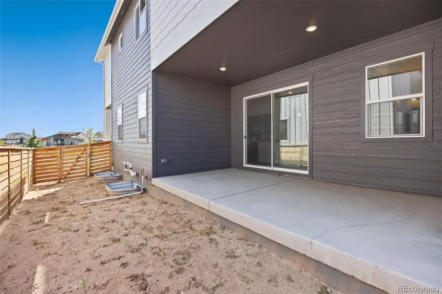 Exterior details and patio area of a home in Trailside on Harmony, Timnath (Image 4).