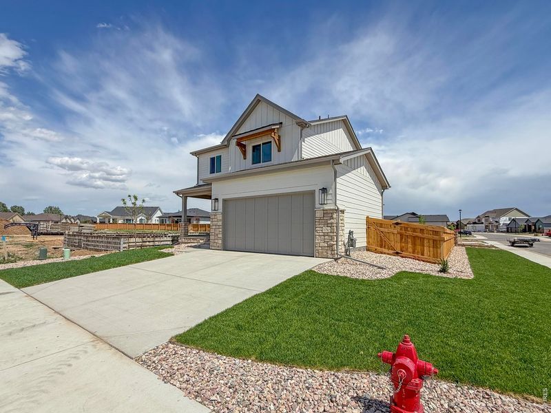 Front exterior of a new home in Greenspire At Windsor Lake, Windsor, CO, highlighting curb appeal (Image 24).