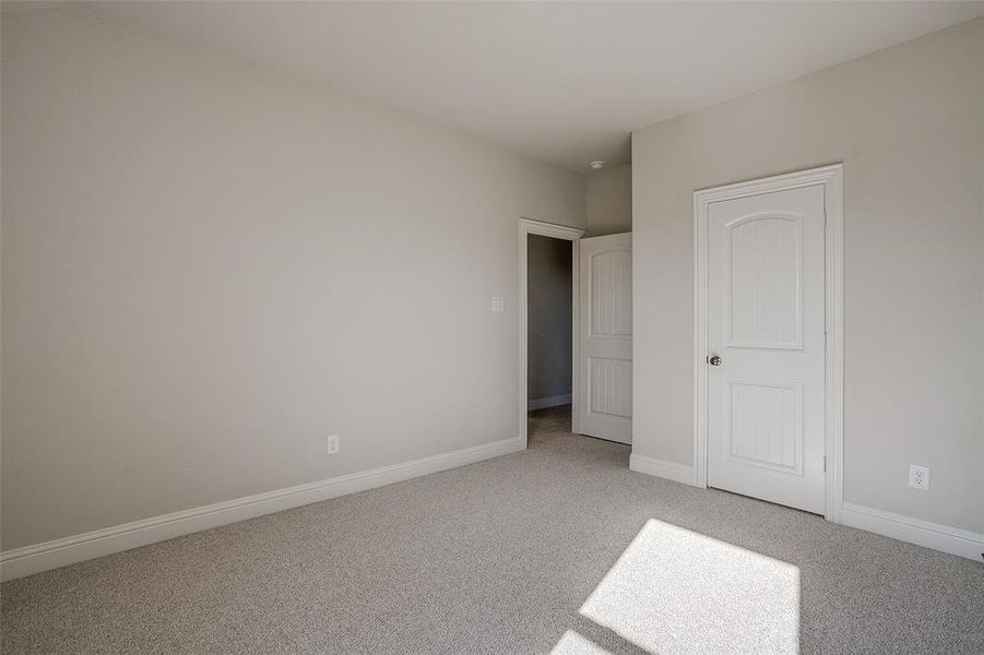 Unfurnished bedroom featuring carpet flooring