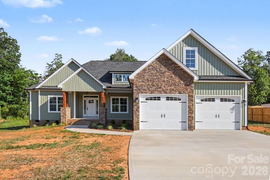 Front exterior of a new home in , China Grove, NC, highlighting curb appeal (Image 1). Front exterior of a new home in , China Grove, NC, highlighting curb appeal (Image 1).