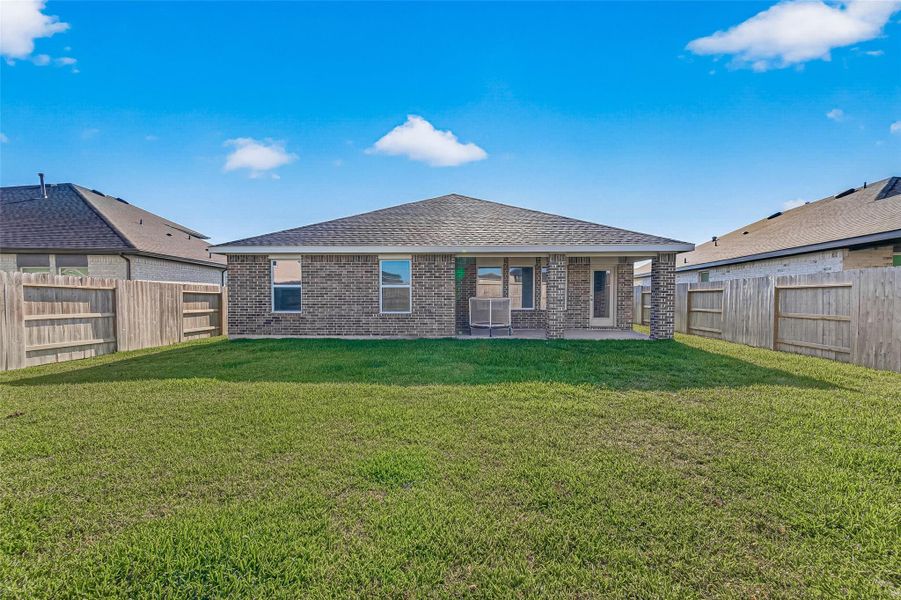 Exterior details and patio area of a home in Sunterra, Katy (Image 25).