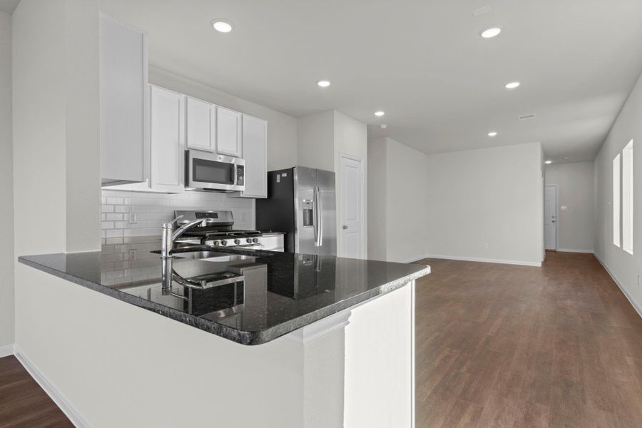 Stunning modern kitchen featuring granite countertops, tall white shaker cabinets, stainless steel appliances, and a deep undermount sink! A perfect blend of beauty and function. Granite countertops will surround you. Stunning modern kitchen featuring granite countertops, tall white shaker cabinets, stainless steel appliances, and a deep undermount sink! A perfect blend of beauty and function. Granite countertops will surround you.