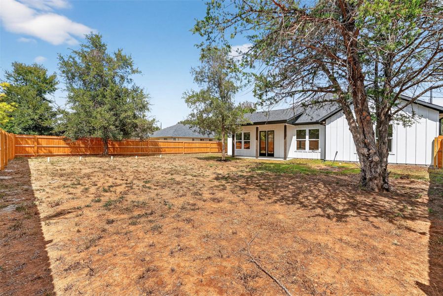 Fenced backyard featuring a patio area
