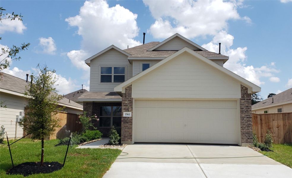 Front exterior of a new home in Ladera Trails: Cottage Collection, Conroe, TX, highlighting curb appeal (Image 1). Front exterior of a new home in Ladera Trails: Cottage Collection, Conroe, TX, highlighting curb appeal (Image 1).