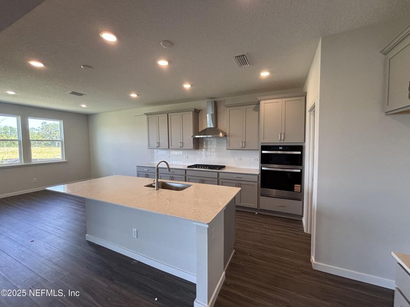 Furnished interior view inside a new home in The Cypress Series at Reserve East, Flagler Beach (Image 6).