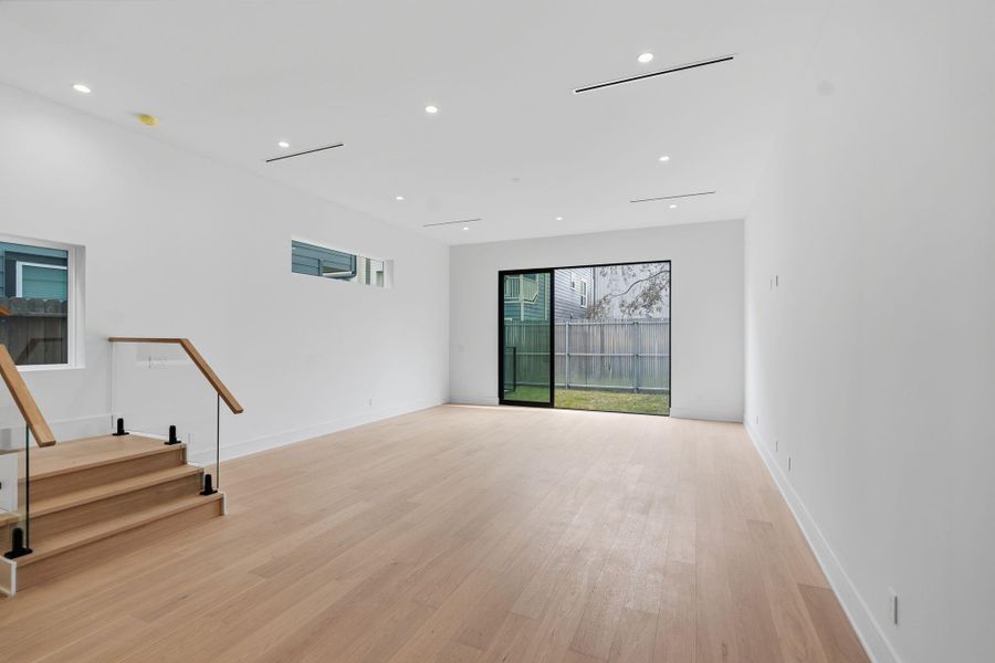 Open concept dining opening to family room.