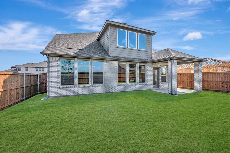 Exterior details and patio area of a home in Lily Creek at Sutton Fields, Aubrey (Image 21).