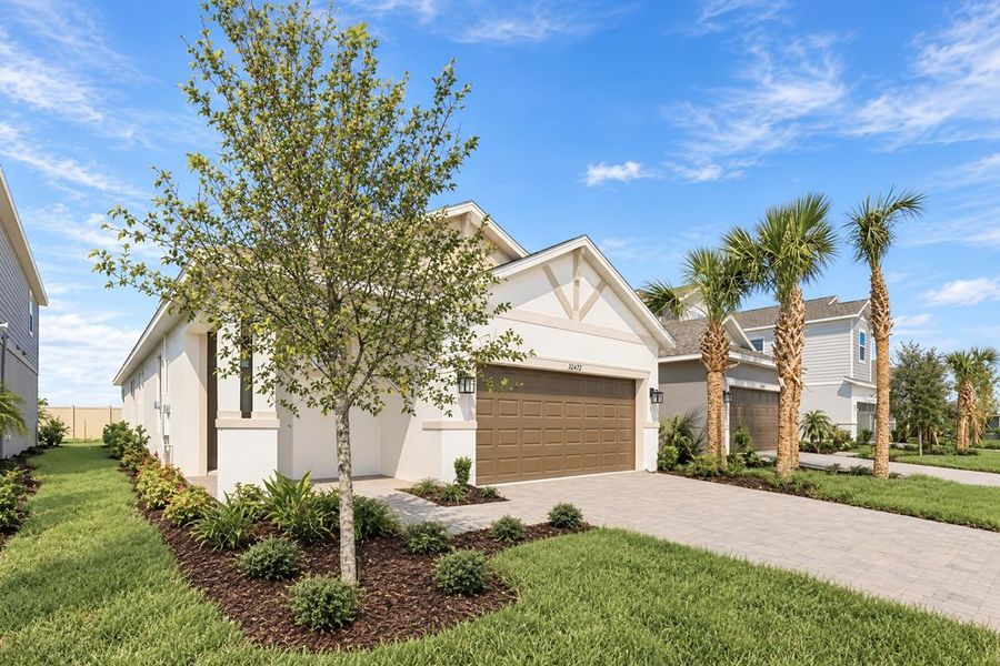 Front exterior of a new home in Lochside, Mount Dora, FL, highlighting curb appeal (Image 2). Front exterior of a new home in Lochside, Mount Dora, FL, highlighting curb appeal (Image 2).