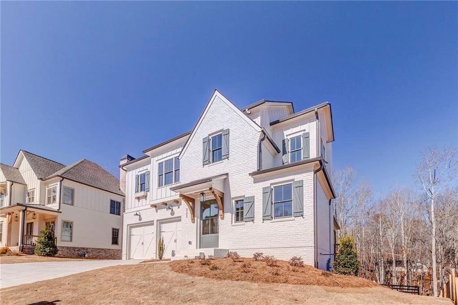 Front exterior of a new home in Malone's Pond, Ball Ground, GA, highlighting curb appeal (Image 24).