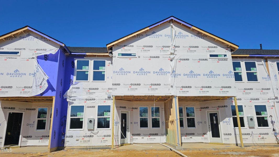 Front exterior of a new home in Springvale, Fuquay Varina, NC, highlighting curb appeal (Image 64).