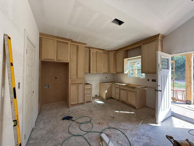 Kitchen featuring light brown cabinets