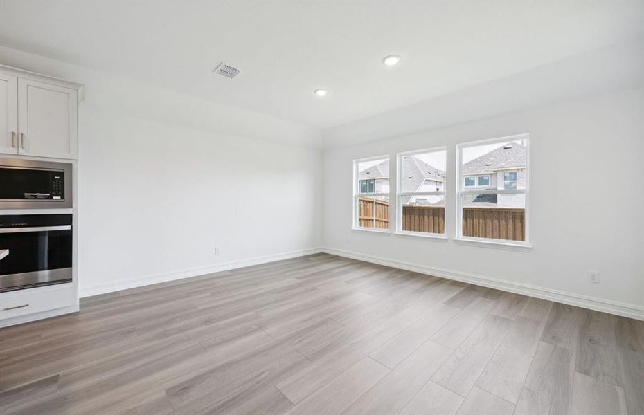 Formal dining room with large windows