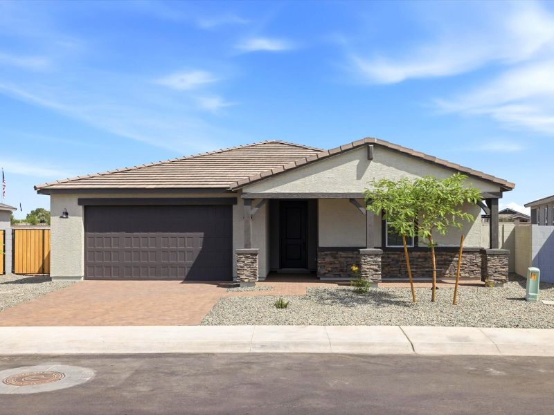 Front exterior of a new home in Legacy Place, Glendale, AZ, highlighting curb appeal (Image 1). Front exterior of a new home in Legacy Place, Glendale, AZ, highlighting curb appeal (Image 1).