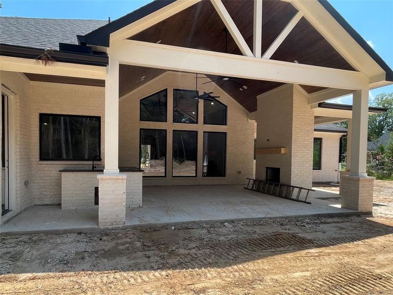 Another view of extended patio area with fireplace and area above already wired for your tv for game time this fall!