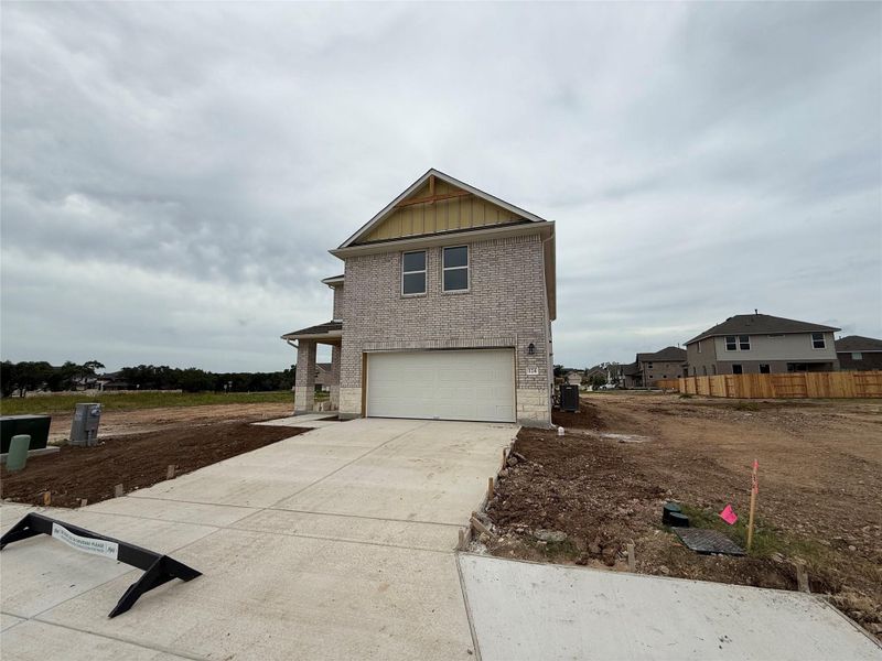 Front exterior of a new home in , San Marcos, TX, highlighting curb appeal (Image 2). Front exterior of a new home in , San Marcos, TX, highlighting curb appeal (Image 2).