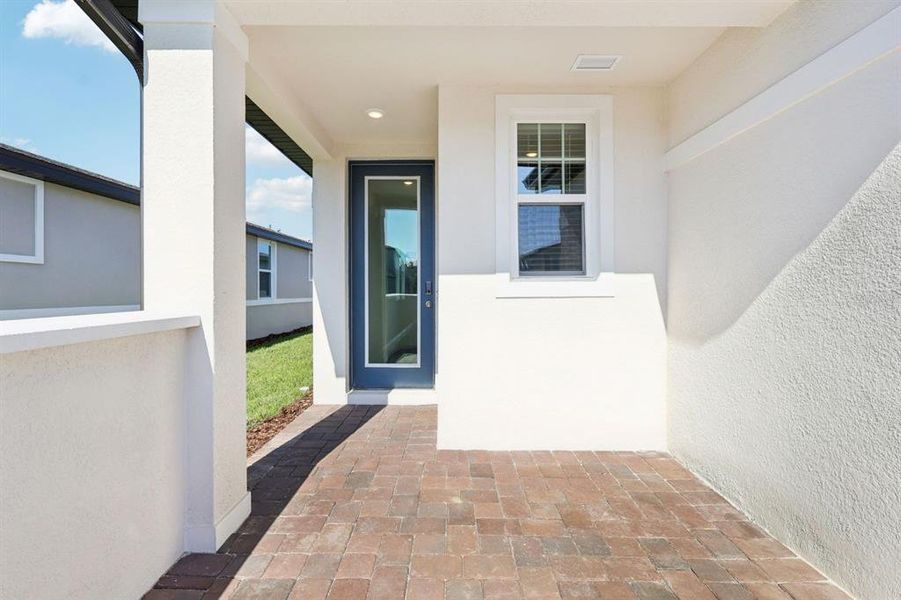 Exterior details and patio area of a home in Springs at Lake Alfred - Classic Series, Lake Alfred (Image 21).
