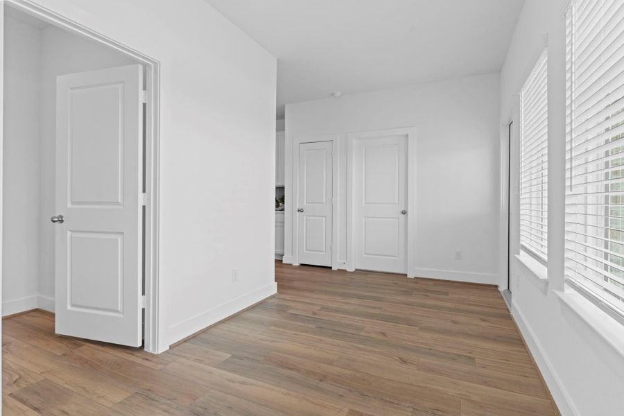 Another angle of the dedicated home office reveals its generous size, large window for natural light, and convenient location near the entry and main living spaces—ideal for productivity and focus. **Image Representative of Plan Only and May Vary as Built**.