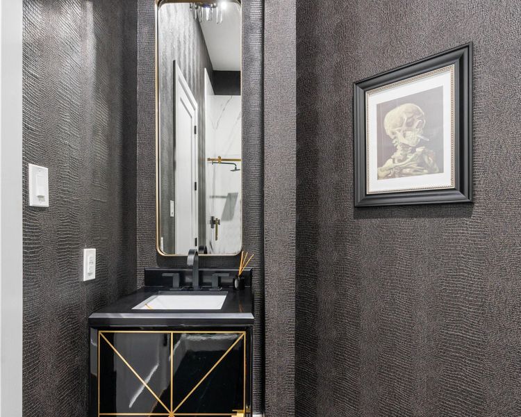 This full bathroom screams modern medieval at its finest. From the extraordinary wall paper to the sink. This full bathroom screams modern medieval at its finest. From the extraordinary wall paper to the sink.