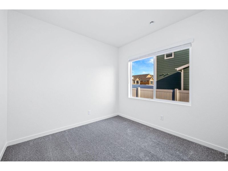Spacious, unfurnished interior of a new home in Union Colony West, Greeley (Image 13).