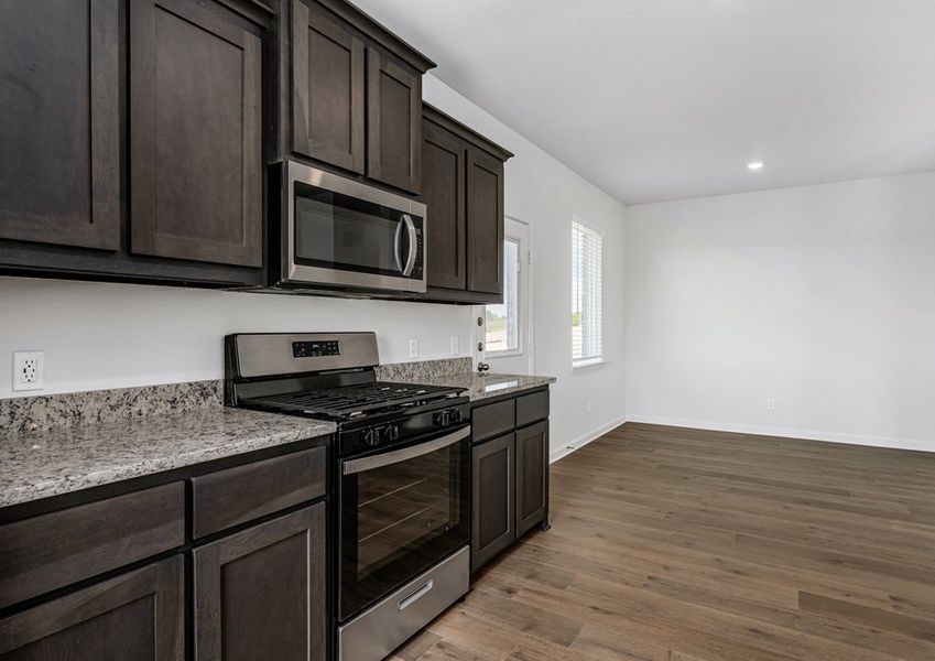 The dining room sits adjacent to the kitchen. The dining room sits adjacent to the kitchen.