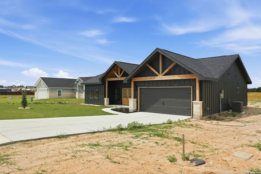 Front exterior of a new home in , La Vernia, TX, highlighting curb appeal (Image 23). Front exterior of a new home in , La Vernia, TX, highlighting curb appeal (Image 23).