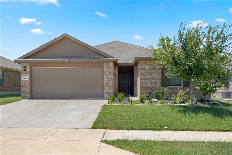 Ranch-style home featuring an attached garage.
