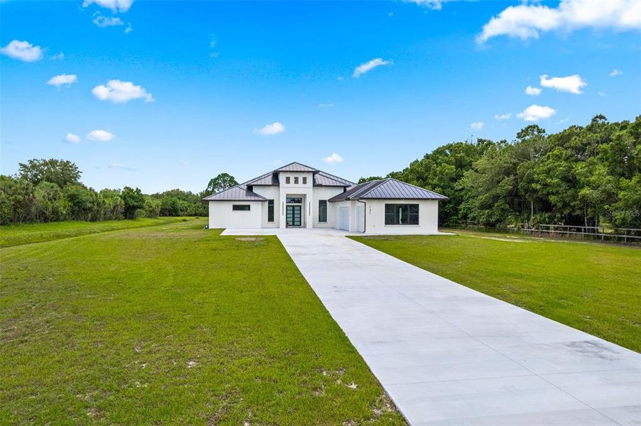 Front exterior of a new home in , Palm Bay, FL, highlighting curb appeal (Image 20). Front exterior of a new home in , Palm Bay, FL, highlighting curb appeal (Image 20).