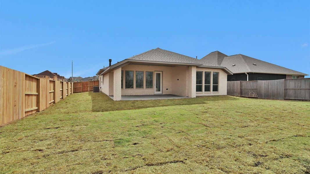 Exterior details and patio area of a home in Meridiana, Manvel (Image 4).