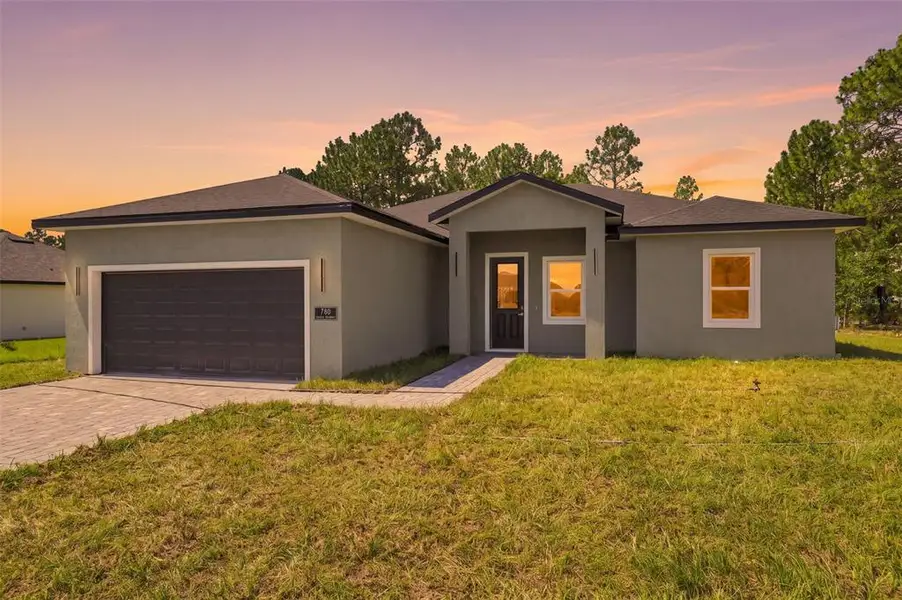 Front exterior of a new home in , Ocala, FL, highlighting curb appeal (Image 1). Front exterior of a new home in , Ocala, FL, highlighting curb appeal (Image 1).