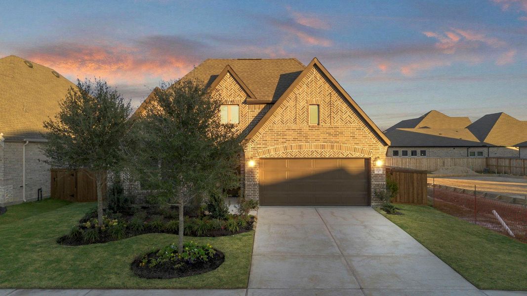 Front exterior of a new home in Dunham Pointe, Cypress, TX, highlighting curb appeal (Image 20).