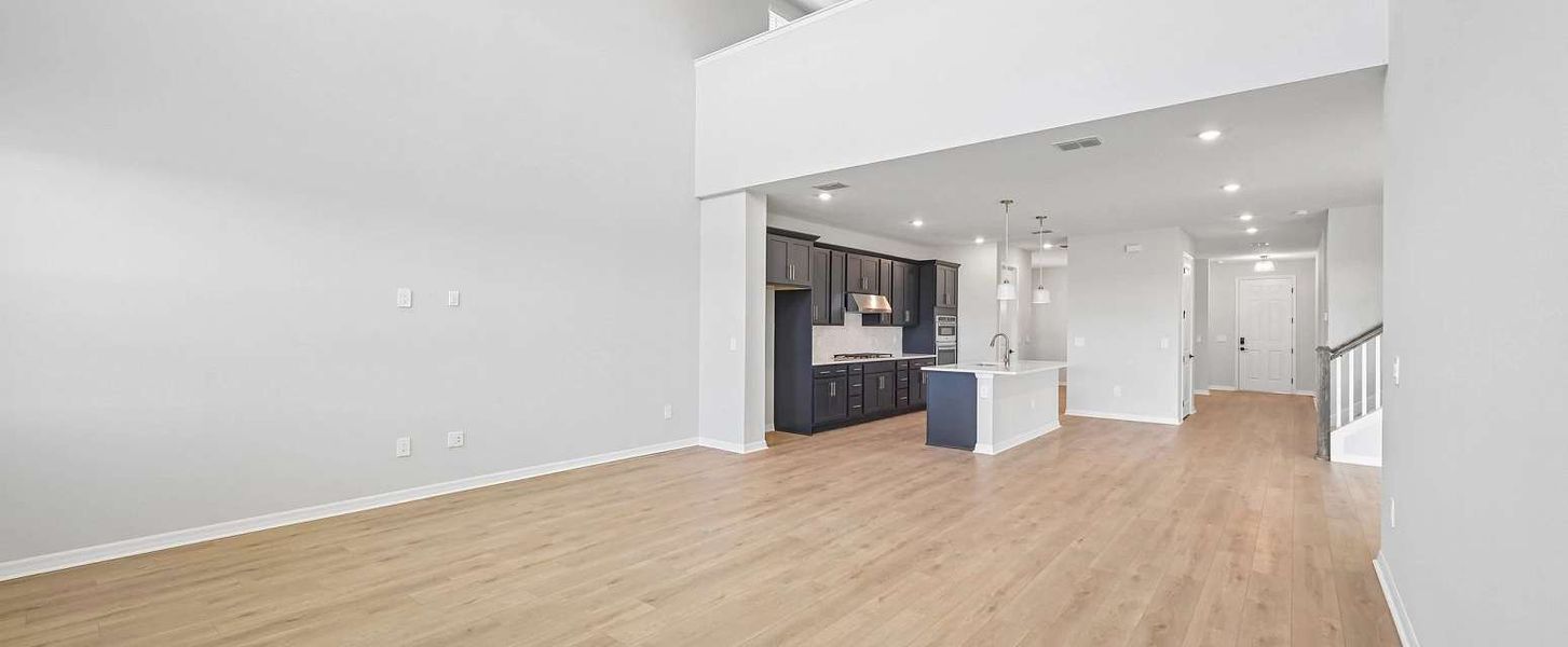 Kitchen space flows into the beautiful two-story great room - Representative images and renderings are for illustrative purposes Kitchen space flows into the beautiful two-story great room - Representative images and renderings are for illustrative purposes