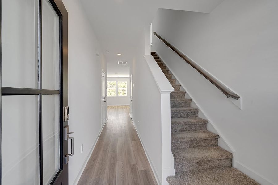 A long hallway with white walls. A long hallway with white walls.