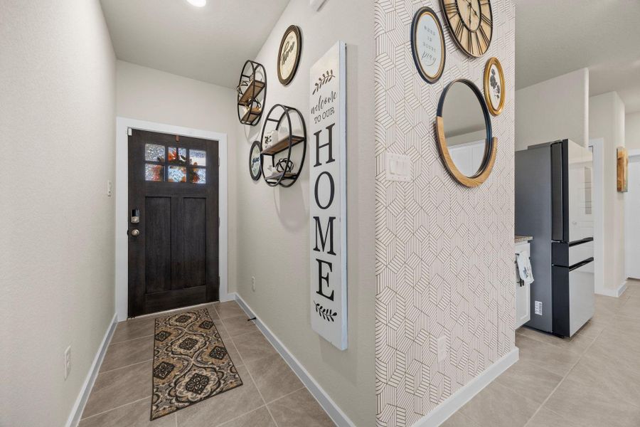 Step inside to a bright and stylish entryway that sets the tone for the rest of the home. Spacious tile flooring leads you seamlessly into the heart of the home!