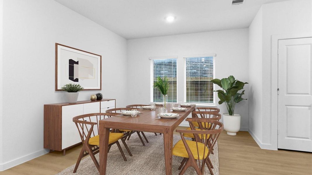 Spacious open concept dining area with vinyl wood flooring and access to the living and kitchen areas Spacious open concept dining area with vinyl wood flooring and access to the living and kitchen areas