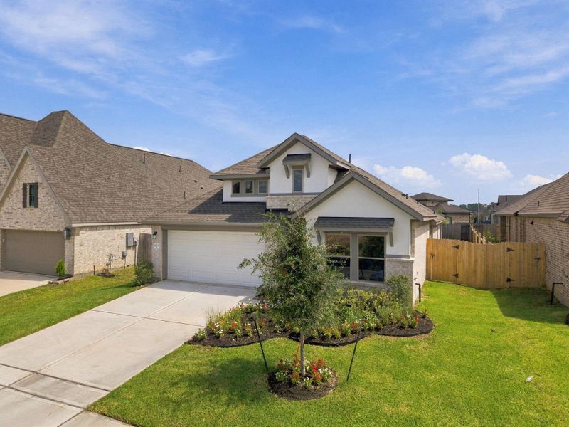 Front exterior of a new home in Escondido, Magnolia, TX, highlighting curb appeal (Image 23).
