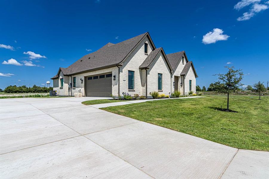 Front exterior of a new home in , Caddo Mills, TX, highlighting curb appeal (Image 1). Front exterior of a new home in , Caddo Mills, TX, highlighting curb appeal (Image 1).