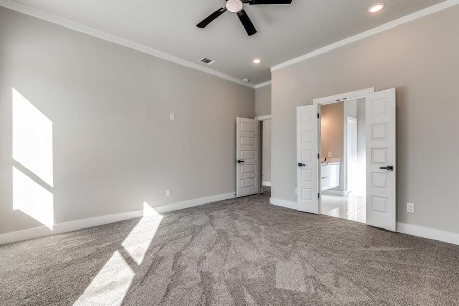 Unfurnished bedroom with light carpet, ornamental molding, ceiling fan, and recessed lighting