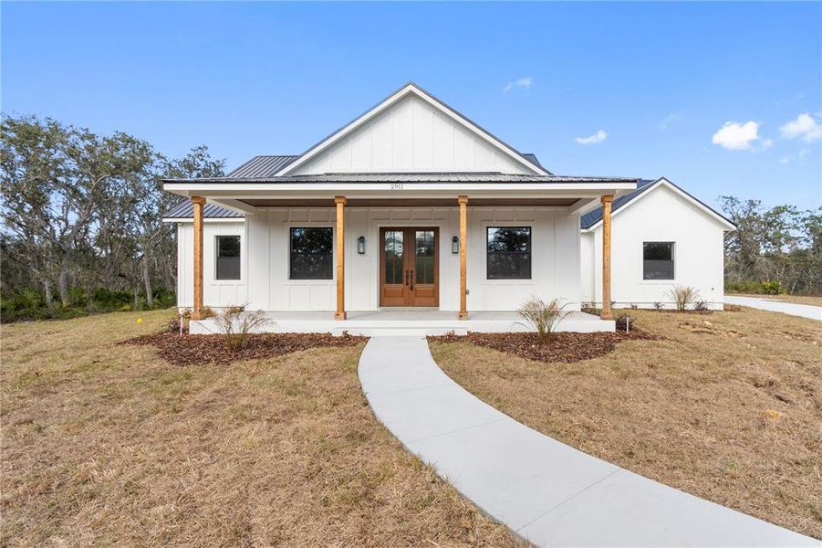 Front exterior of a new home in , Frostproof, FL, highlighting curb appeal (Image 1). Front exterior of a new home in , Frostproof, FL, highlighting curb appeal (Image 1).