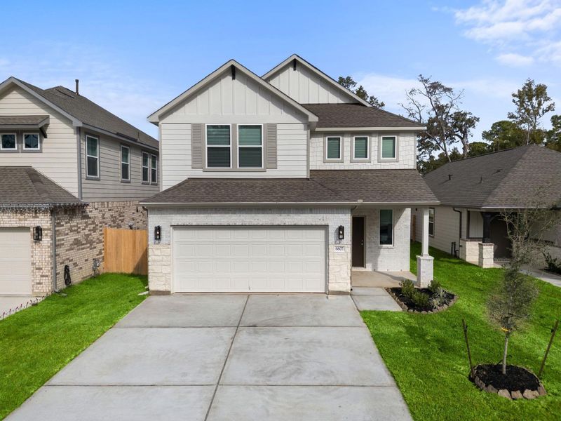 Front exterior of a new home in Cypresswood Landing, Humble, TX, highlighting curb appeal (Image 12). Front exterior of a new home in Cypresswood Landing, Humble, TX, highlighting curb appeal (Image 12).
