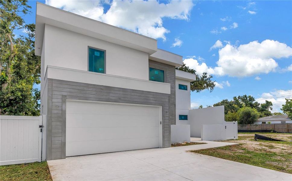 Front exterior of a new home in , Sarasota, FL, highlighting curb appeal (Image 1).