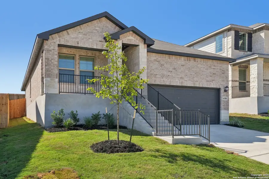 Front exterior of a new home in Comanche Ridge, San Antonio, TX, highlighting curb appeal (Image 2). Front exterior of a new home in Comanche Ridge, San Antonio, TX, highlighting curb appeal (Image 2).
