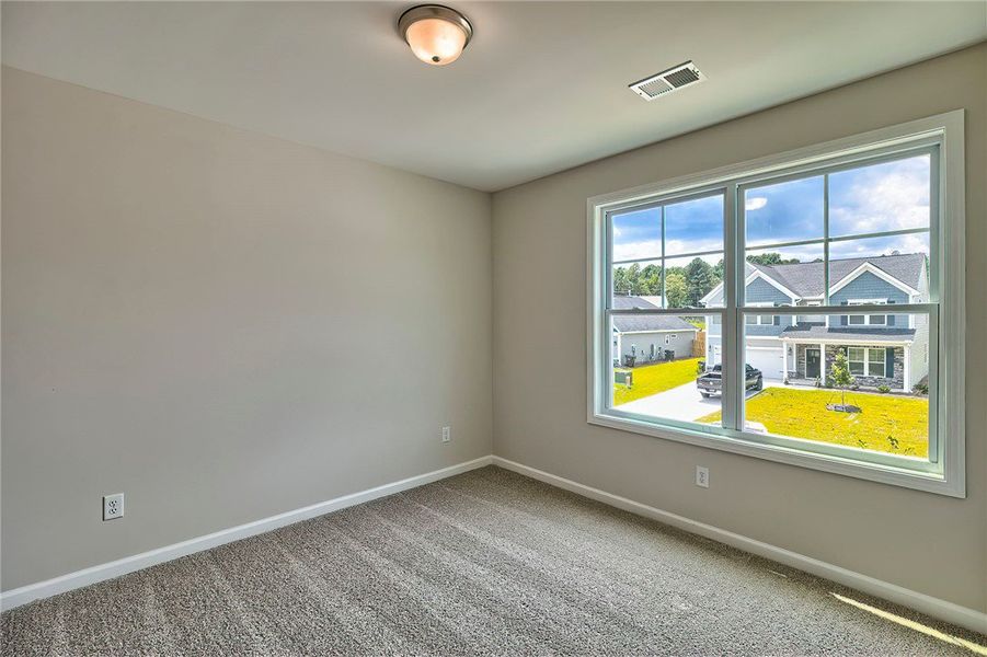 This bright room features a large window, offering